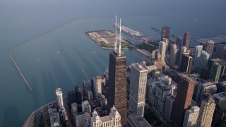 AX0001_133 - 4.8K aerial stock footage of John Hancock Center near Lake Michigan, Downtown Chicago, Illinois