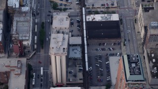 AX0001_144 - 4.8K aerial stock footage of a bird's eye of tracking an L Train through Downtown Chicago, Illinois
