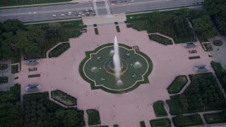 AX0001_150 - 4.8K aerial stock footage view of Buckingham Fountain, Grant Park, Downtown Chicago, Illinois
