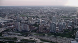 AX0001_153 - Aerial stock footage of 4.8K aerial  video of apartment buildings in the Prairie District, on a hazy day, Chicago, Illinois