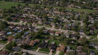 AX0002_001 - 4.8K aerial stock footage flying by a suburban residential neighborhood, Calumet City, Illinois