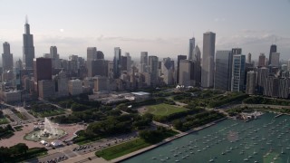 AX0002_006 - 4.8K aerial stock footage approach Grant Park and Downtown Chicago skyscrapers, Illinois