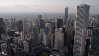 AX0002_007 - 4.8K aerial stock footage tilt from Lake Shore Drive, revealing Cloud Gate, Jay Pritzker Pavilion, and downtown Chicago skyscrapers, Illinois