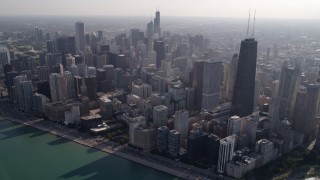 AX0002_017 - 4.8K aerial stock footage tilt from Lake Shore Drive to John Hancock Center and skyscrapers in Downtown Chicago, Illinois