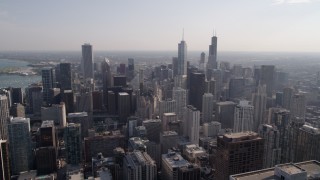 AX0002_025 - 4.8K aerial stock footage of flying over Downtown Chicago toward Trump Tower Chicago on a hazy day, Illinois