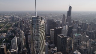 AX0002_027 - 4.8K aerial stock footage tilt from Tribune Tower to reveal and approach Trump Tower Chicago and Willis Tower, Downtown Chicago, Illinois