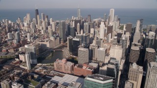 AX0002_035 - 4.8K aerial stock footage flyby downtown skyscrapers and the Chicago River in Downtown Chicago, Illinois
