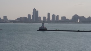 AX0002_047 - 4.8K aerial stock footage of orbiting Chicago Harbor Lighthouse with the Downtown Chicago skyline in the background, Illinois