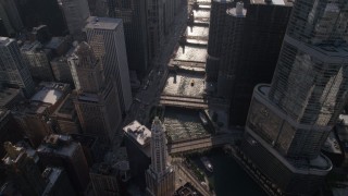 AX0002_054 - 4.8K aerial stock footage of bird's eye view of bridges spanning Chicago River, revealing Tribune Tower and Marina City, Downtown Chicago, Illinois