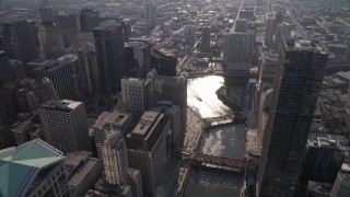 AX0002_055 - 4.8K aerial stock footage of bird's eye of the Chicago River through downtown, and bridges spanning the river, Downtown Chicago, Illinois
