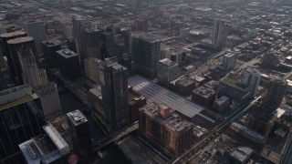 AX0002_056 - 4.8K aerial stock footage of following the river through downtown to train station and pan to follow river, Downtown Chicago, Illinois