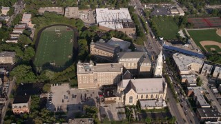 AX0002_061 - 4.8K stock footage aerial video orbiting the football field at St. Ignatius College Prep, West Side Chicago, Illinois