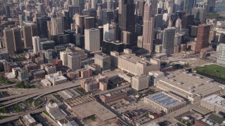 AX0002_063 - 4.8K aerial stock footage tilt from freeway near Circle Interchange and reveal Willis Tower and Downtown Chicago, Illinois