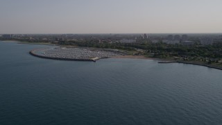 AX0002_089 - 4.8K aerial stock footage of flying over Lake Michigan toward 31st Street Harbor, Chicago, Illinois