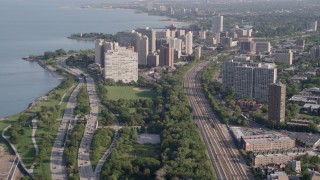 AX0002_093 - 4.8K aerial stock footage tilt from Highway 41 to reveal apartment buildings in Hyde Park, Chicago, Illinois