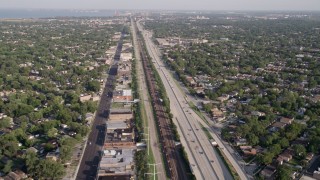 AX0002_101 - 4.8K aerial stock footage approach Interstate 90, passing urban neighborhoods, South Chicago, Illinois