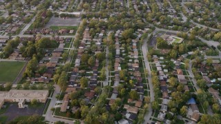 AX0003_004 - 4.8K aerial stock footage of flying over residential neighborhoods at sunset, Calumet City, Illinois
