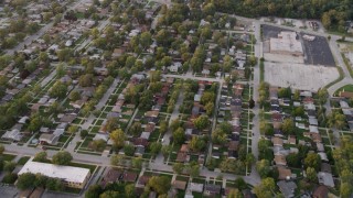 AX0003_005 - 4.8K aerial stock footage of flying over neighborhood in Calumet City at sunset, Chicago, Illinois