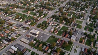 AX0003_007 - 4.8K aerial stock footage of a reverse view of a residential neighborhood in Calumet City, Illinois at sunset