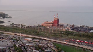 AX0003_009 - 4.8K aerial stock footage of approaching State Line Generating Plant by Lake Michigan, Hammond, Indiana