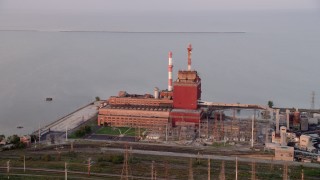 AX0003_010 - 4.8K aerial stock footage of approaching the State Line Generating Plant at sunset, Hammond, Indiana
