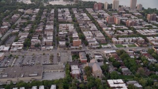 AX0003_015 - 4.8K aerial stock footage of apartment buildings and elementary school in Jackson Park Highlands, at twilight, Chicago, Illinois