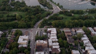 AX0003_016 - 4.8K aerial stock footage fly over apartment buildings, reveal Jackson Park Golf Course and harbor, Jackson Park Highlands, Chicago, Illinois, twilight