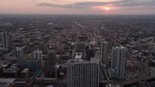 AX0003_041 - 4.8K aerial stock footage of flying over 333 N Canal Street condo complex and apartment buildings, West Chicago, Illinois, sunset