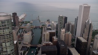 AX0003_060 - 4.8K aerial stock footage pass Trump International Hotel and Tower, revealing Chicago River and Navy Pier, at sunset, Illinois
