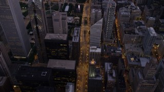 AX0003_100 - 4.8K aerial stock footage bird's eye view of N Michigan Avenue past Two Prudential Plaza to Grant Park, Downtown Chicago, Illinois, twilight