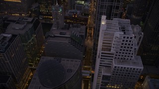 AX0003_107 - 4.8K aerial stock footage following N Clark Street past the James R. Thompson Center to river at twilight, Downtown Chicago Illinois