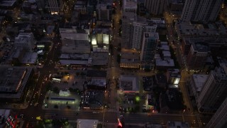 AX0003_110 - 4.8K aerial stock footage of a bird's eye view of following Clark Street through Downtown Chicago at twilight, Illinois