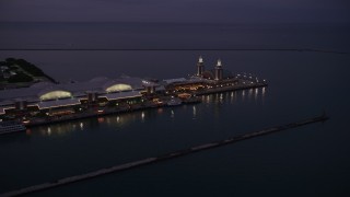 AX0003_123 - 4.8K aerial stock footage of flying by Navy Pier at twilight in Chicago, Illinois