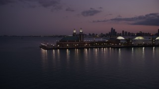 AX0003_126 - 4.8K aerial stock footage approach and flyby the end of Navy Pier at twilight, Chicago, Illinois