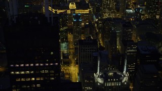 AX0003_155 - 4.8K aerial stock footage of flying by Willis Tower at night and tilt to N Franklin Street, Downtown Chicago, Illinois