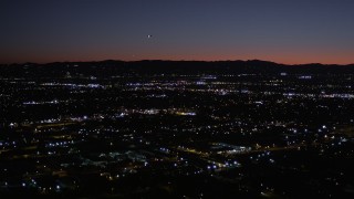 AX0004_003 - 5K aerial stock footage of flying over Van Nuys suburban neighborhoods at night, California