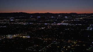 AX0004_004 - 5K aerial stock footage of Van Nuys suburban neighborhoods at night, California