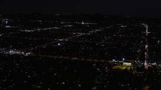AX0004_005 - 5K aerial stock footage of suburban residential neighborhoods at night in Van Nuys, California