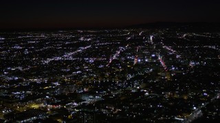 AX0004_031 - 5K aerial stock footage flyby MacArthur Park Lake in Los Angeles at night, California