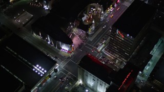 AX0004_079 - 5K stock footage aerial video reverse view of Grauman's Chinese Theater on Hollywood Boulevard at night, California