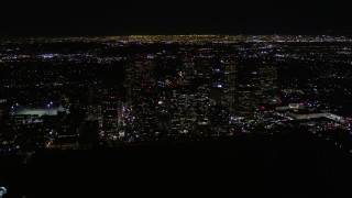 AX0004_086 - 5K aerial stock footage orbit Century City skyscrapers at night in California