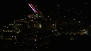 AX0004_096E - 5K aerial stock footage orbit the J. Paul Getty Museum at night in Brentwood, California