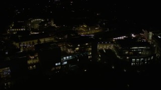 AX0004_101E - 5K aerial stock footage of close orbit of the J. Paul Getty Museum at night in California