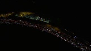 AX0004_103 - 5K aerial stock footage of bird's eye view of panning across Interstate 405 at night, California