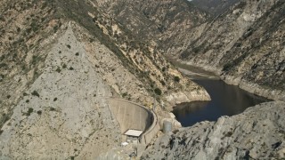 AX0005_001E - 5K stock footage aerial video of revealing Pacoima Dam in San Gabriel Mountains, California
