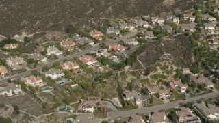 AX0005_011 - 5K aerial stock footage fly over suburban tract homes in Santa Clarita, California