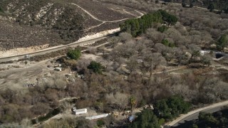 AX0005_023 - 5K aerial stock footage of railroad tracks and dry vegetation in Santa Clarita, California