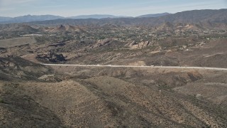 AX0005_035 - 5K stock footage aerial video approach Vasquez Rocks Park in the Mojave Desert, California