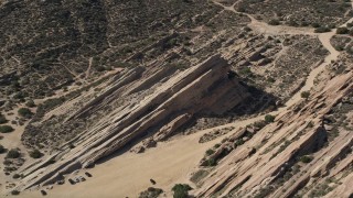 AX0005_045E - 5K stock footage aerial video orbit rugged desert rock formations at Vasquez Rocks Park in California