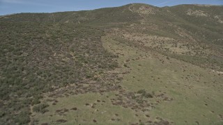 AX0005_051E - 5K aerial stock footage of flying up slopes of arid Sierra Pelona Mountains in California
